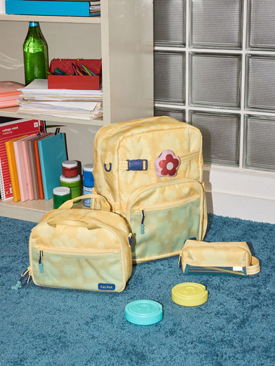 CALPAK Kids Collection Large Kids Backpack Bundle in yellow flower print Yellow Bloom that includes Kids Lunch Bag, Kids Pencil Case, red and pink Flower Pluffy Bag Charm, and Set of 2 Ice Packs; BCKL5000-YELLOW-BLOOM view 2