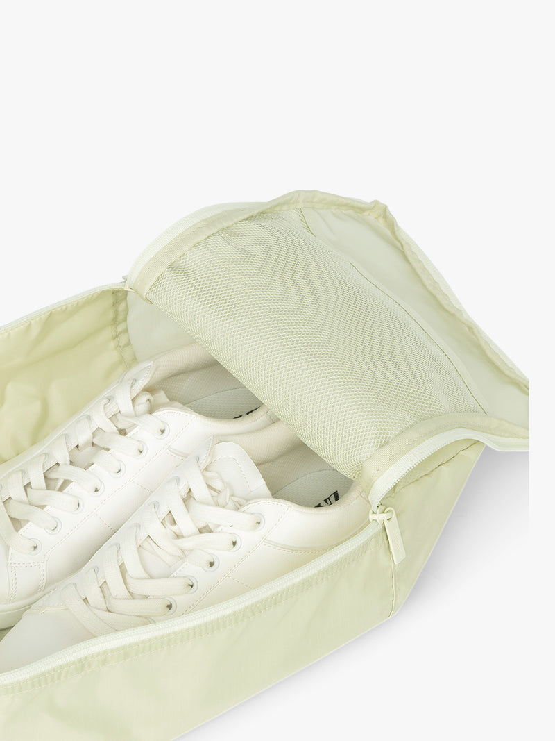 Close up of CALPAK Shoe Bag in light green Celadon