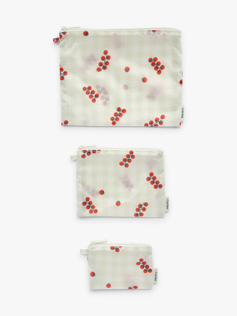 Small Medium Large pouch layouts of CALPAK Compakt ZIppered Pouch Set in white and green gingham with tomato print