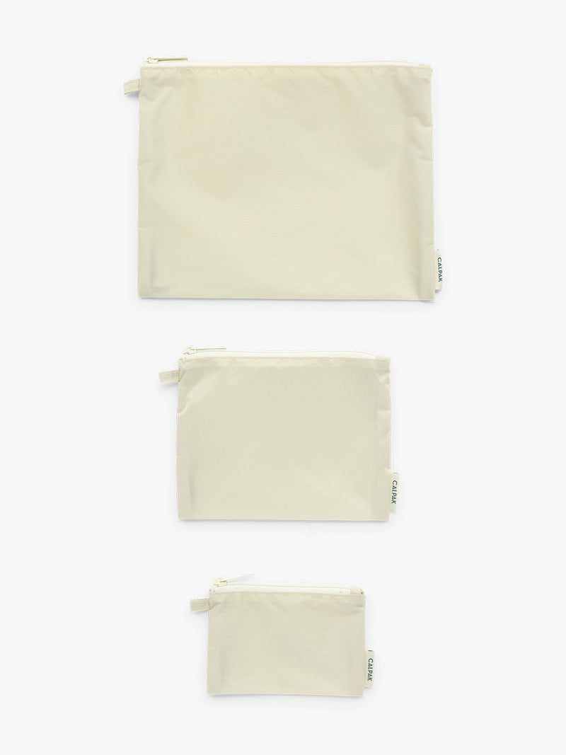 Small Medium Large sizes of CALPAK Compakt ZIppered Pouch Set in light green Celadon