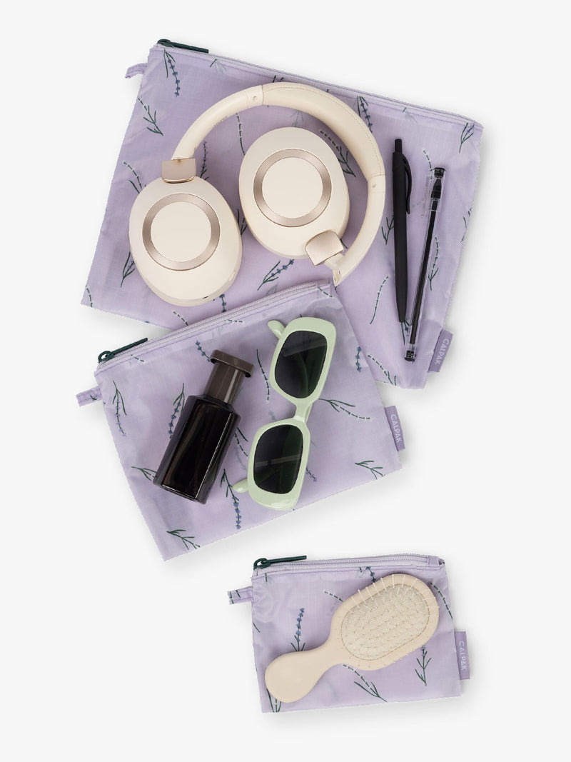 Items that fit into the CALPAK Compakt Zip Pouch Set in light purple with lavender print