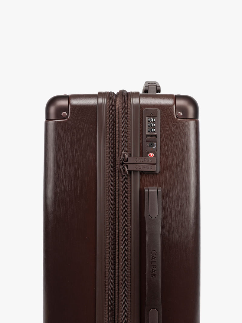 TSA lock of CALPAK Ambeur Medium in brown Walnut with metallic look