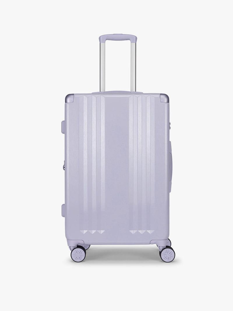 CALPAK Ambeur Medium Luggage in light lavender purple in Sea Glass with handles and spinner wheels on a white background