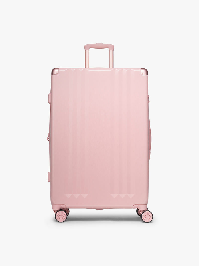 CALPAK 3pc Ambeur Luggage Set featuring the Ambeur Large Luggage in metallic pink Blossom with pink wheels