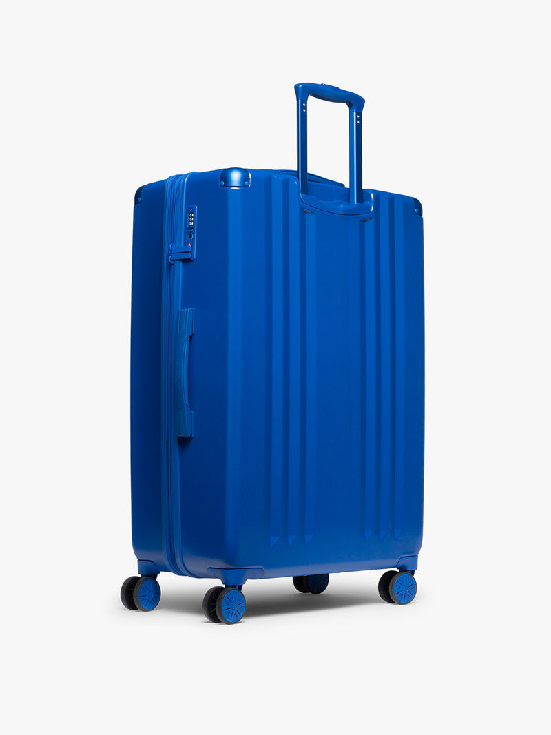 CALPAK Ambeur Large Luggage back view in dark blue Cobalt
