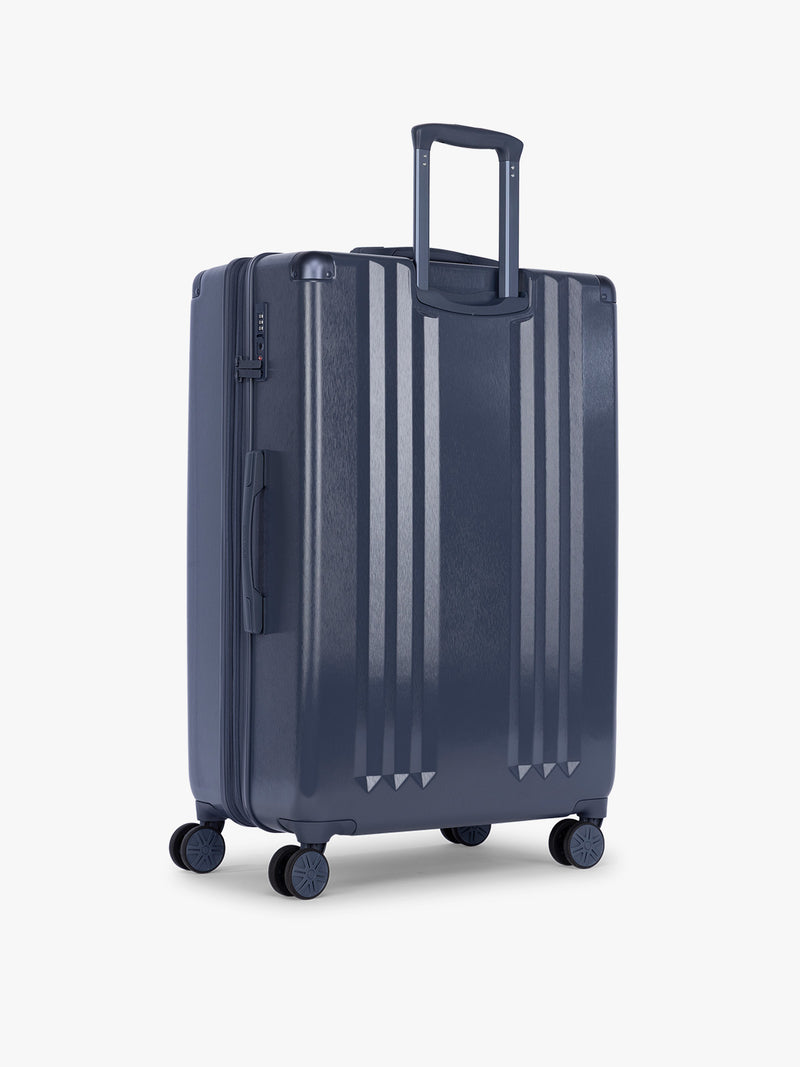 Back side  of CALPAK Ambeur Large Luggage in dark blue metallic Indigo