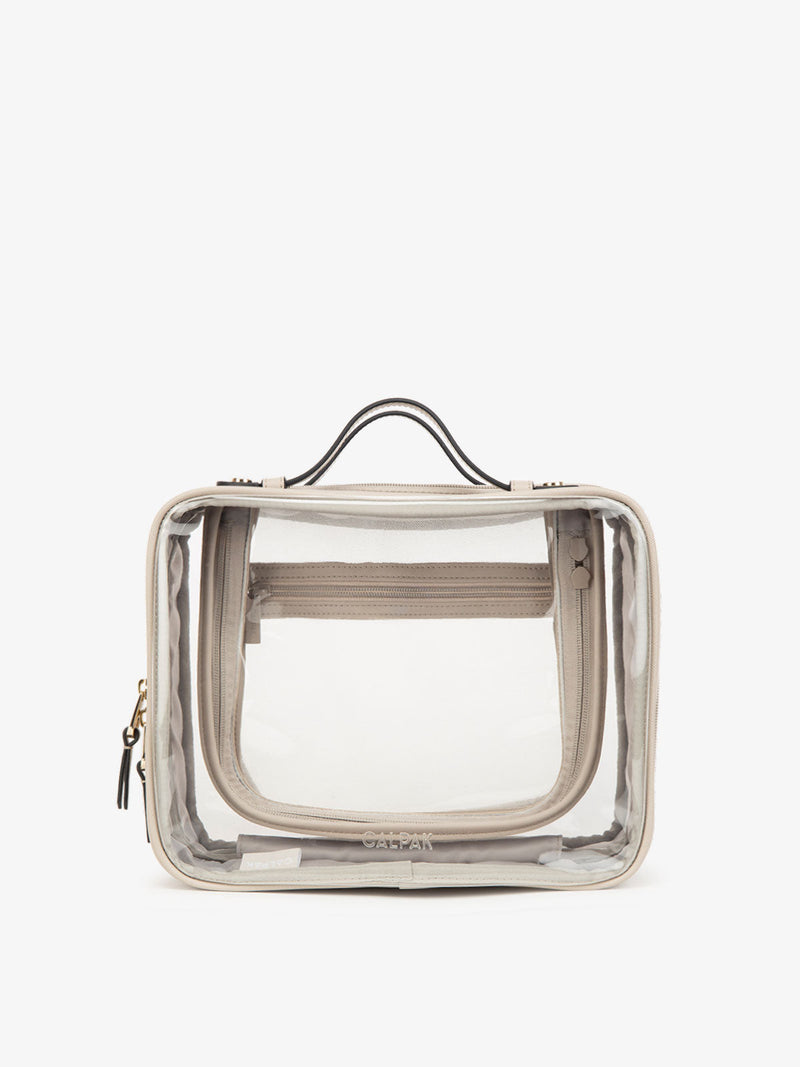 A front view of the Large Clear Cosmetic Case in a stone color. The transparent design showcases its spacious interior, allowing easy visibility of stored items