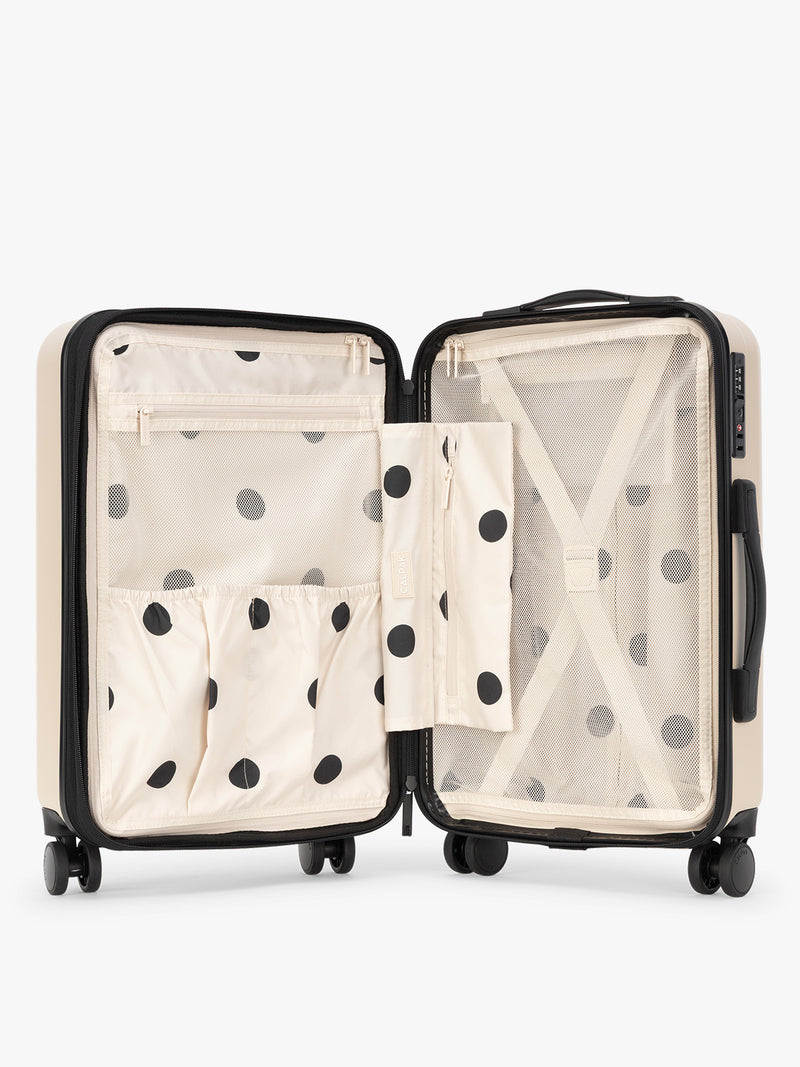 Inside view of the polka dot CALPAK Evry Carry-On Luggage in beige exterior and polka dot interior Polka Dot