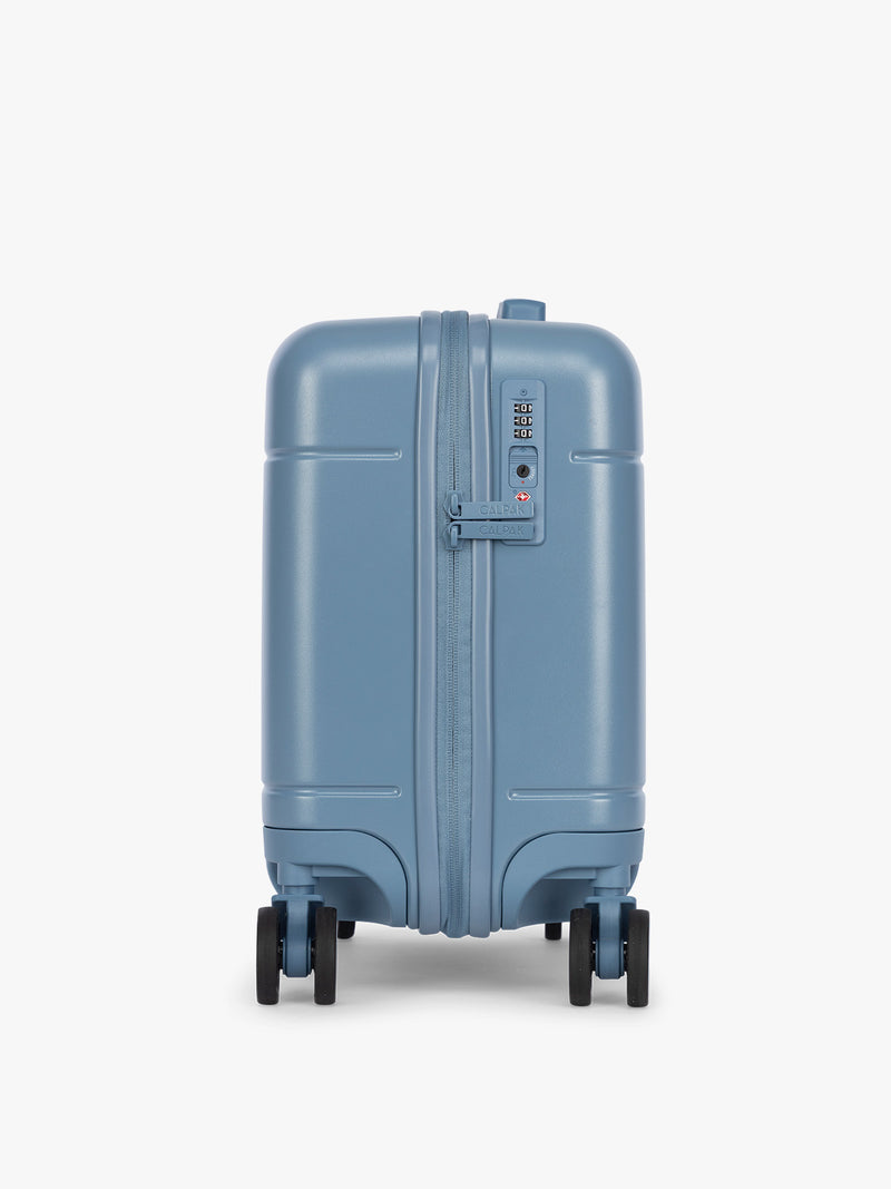 Side view and TSA approved lock of CALPAK Hue Mini Carry On in light blue French Blue with Gingham interior