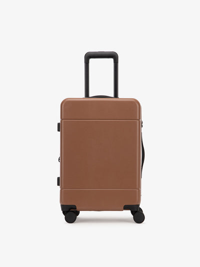 CALPAK Hue hard shell rolling carry-on luggage in pink sand color; LHU1020-NP-HAZEL view 1