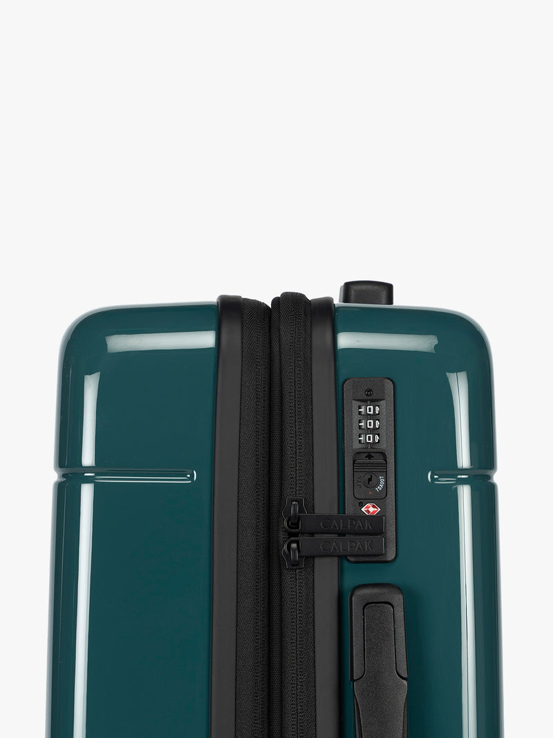 Side view and TSA approved lock of CALPAK Hue Medium Luggage in dark green Kale