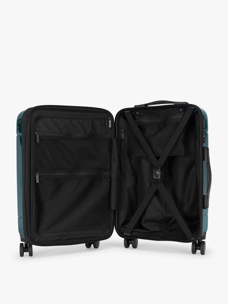 Opened CALPAK Hue Carry On Luggage in dark green Glazed Kale