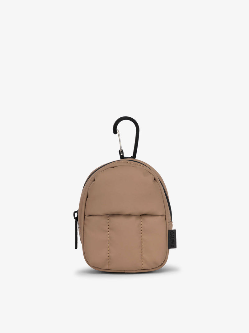 The Luka Key Pouch in chocolate, featuring a compact design with a zippered closure and a carabiner clip attachment.