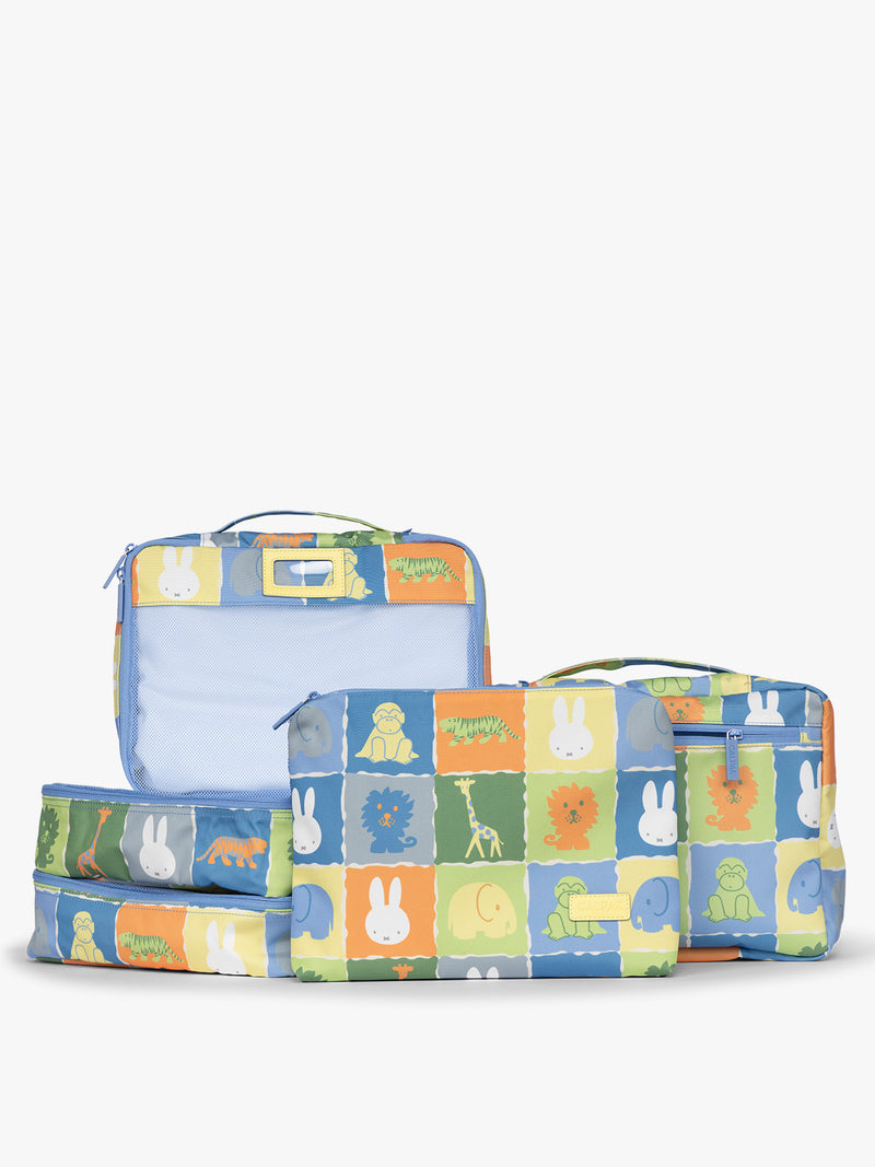 Set of CALPAK Packing Cubes in colorful blue pouches with Miffy and animal pattern on a white background