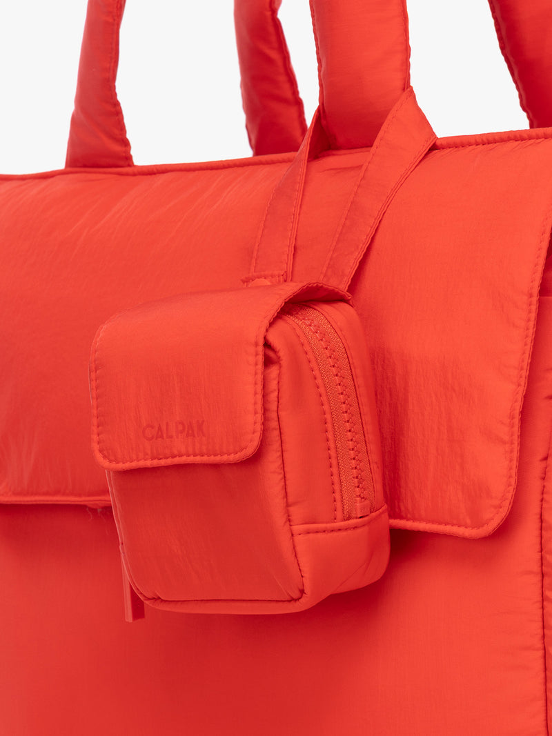 CALPAK Pacifier Pouch in red Tomato on a bag