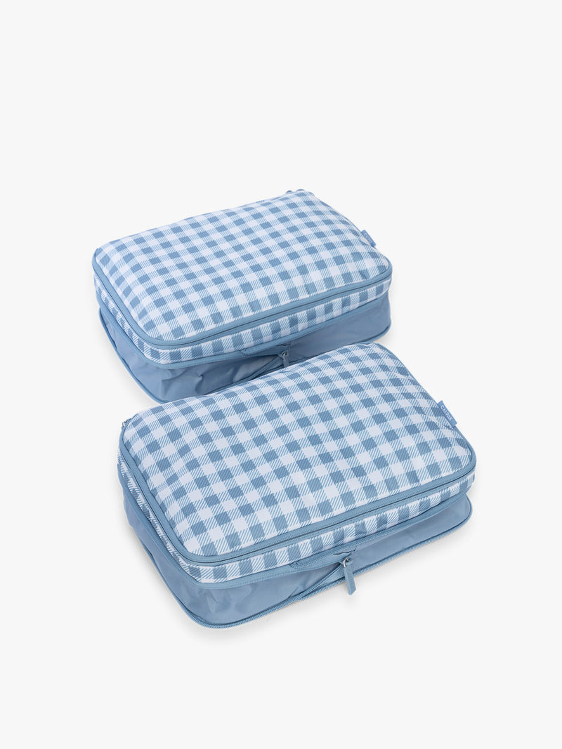 CALPAK Medium Compression Packing Cubes (Set of 2) uncompressed in white and blue gingham print in French Blue Gingham
