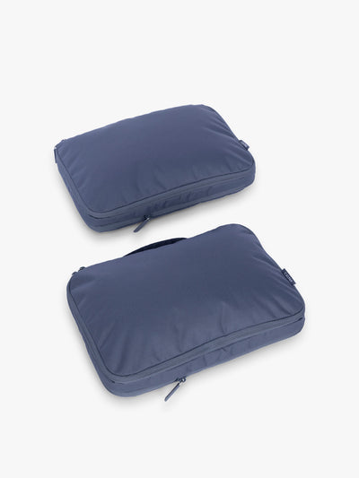 CALPAK Medium Compression Packing Cubes (Set of 2) compressed in dark blue Indigo; PCC2201-INDIGO view 1