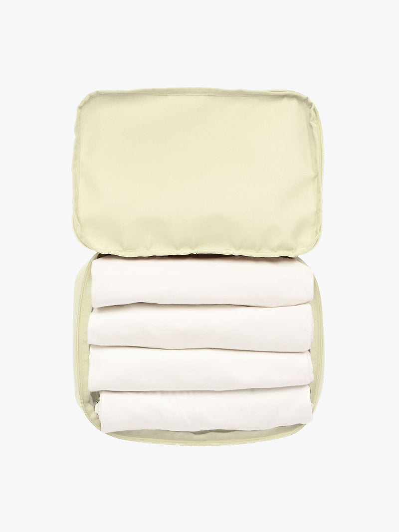 Items in CALPAK Medium Compression Packing Cubes in light green Celadon