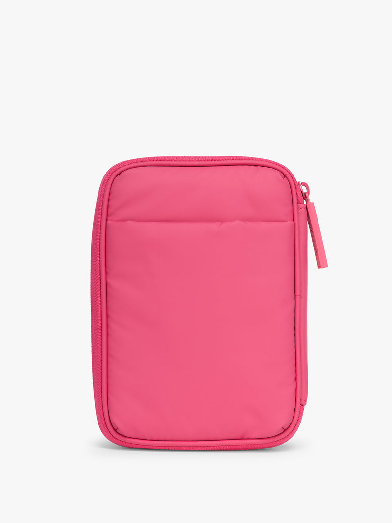 Back side with pocket of CALPAK Luka Zip Passport Wallet in bright pink Dragonfruit on a white background