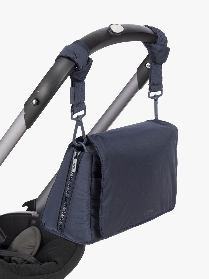 CALPAK Convertible Stroller Cady in blue Navy strapped to stroller