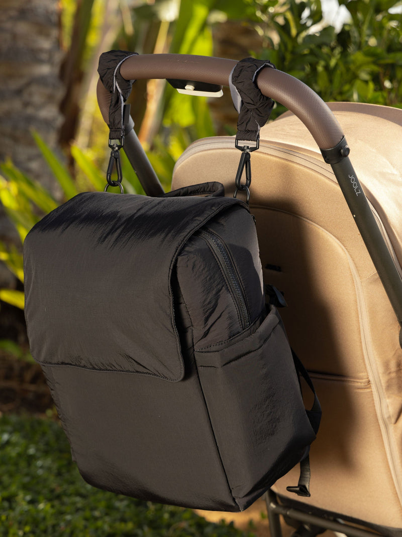 CALPAK Stroller Straps attached to Diaper Backpack with Laptop Sleeve in black