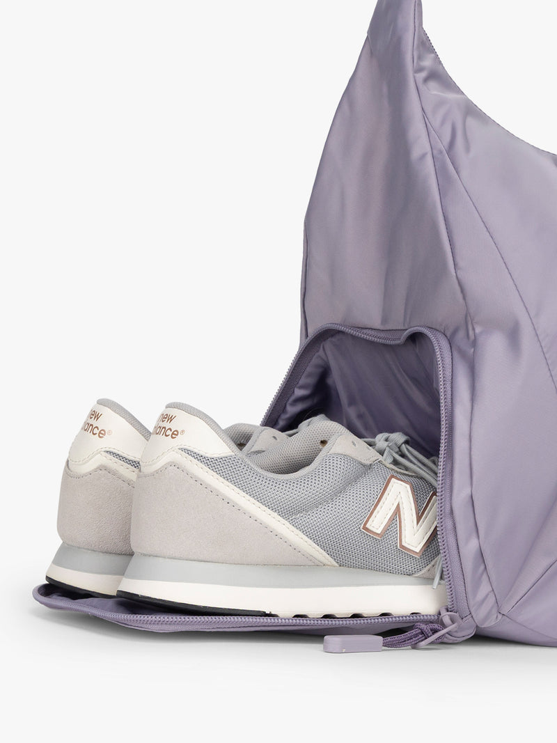 Shoe compartment for the CALPAK Fit Gym Duffel Bag in purple Iris