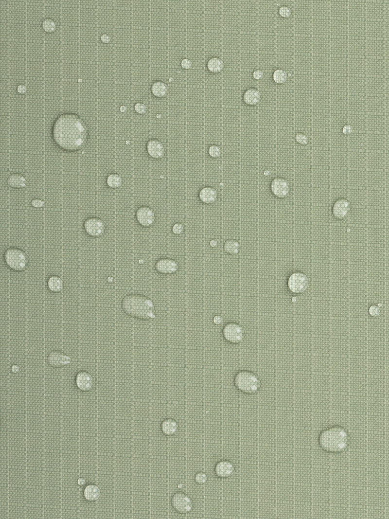 Zoomed in product photo of CALPAK Terra 35L Carry-On luggage water-resistant material with soft shell and 360 spinner wheels in green juniper
