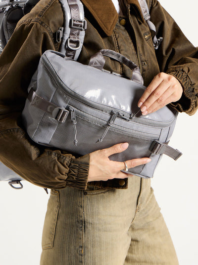 CALPAK Terra Sling Bag with mesh front pocket and top handle in gray storm; CBH2201-STORM view 2
