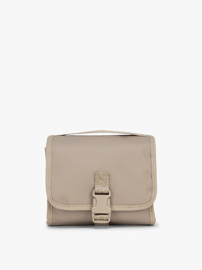 CALPAK Terra Hanging Toiletry Bag in beige Stone front view; THY2201-STONE view 1