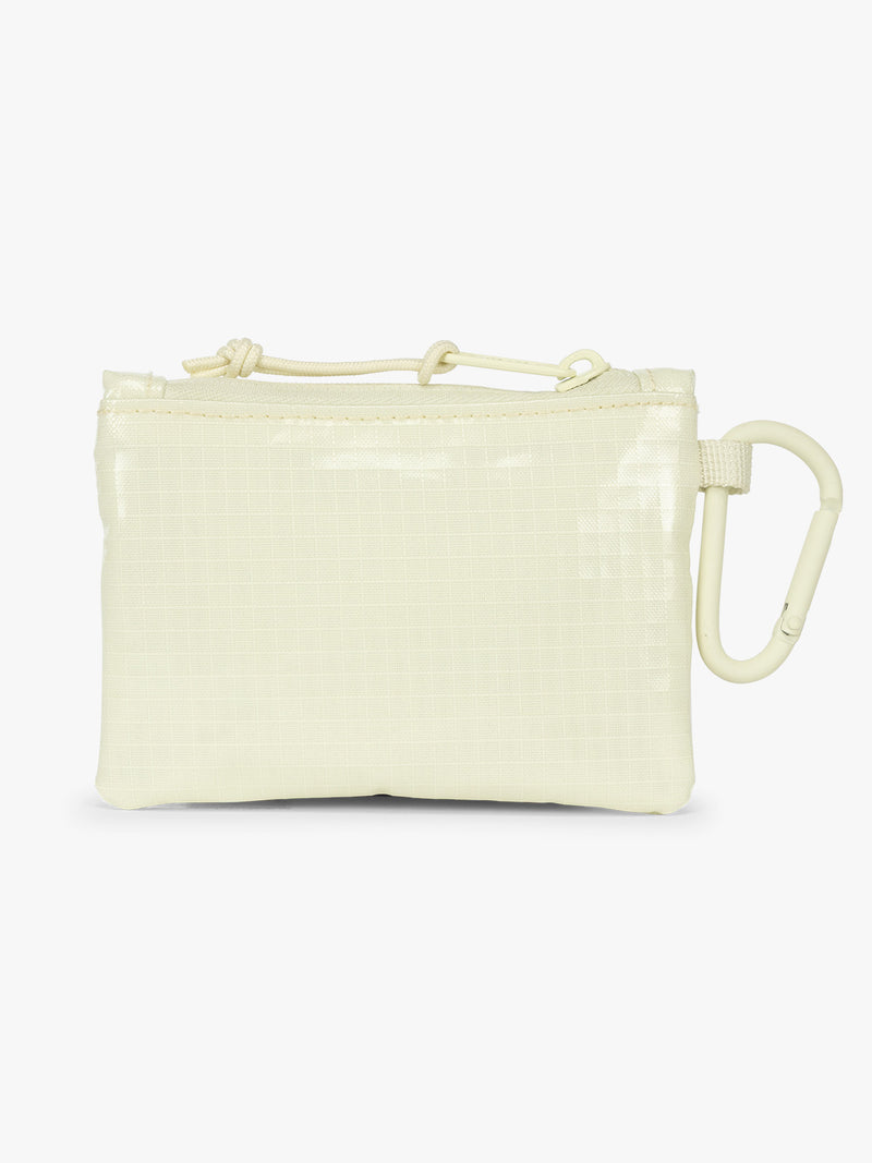 Backside of CALPAK Terra Clippable Card Pouch in light green Celadon on a white background with a carabiner