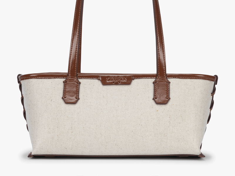 Gif of CALPAK Colette Canvas Shoulder Tote in Natural Brown showing personalization feature 