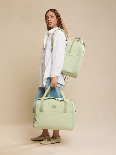 CALPAK Laptop Duffel in light green Meadow front view with white background; DCN2401-MEADOW view 2