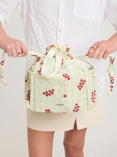 CALPAK Insulated Lunch Bag in light green Celadon and white gingham print with red tomato pattern; ALB2001-CELADON-TOMATO-PICNIC view 2