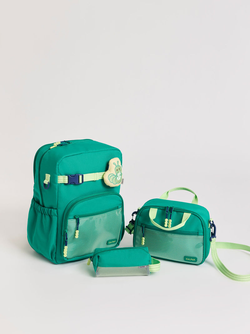 Green CALPAK Kids Small Essentials Bundle that includes backpack and lunch bag, and pencil case light gray background