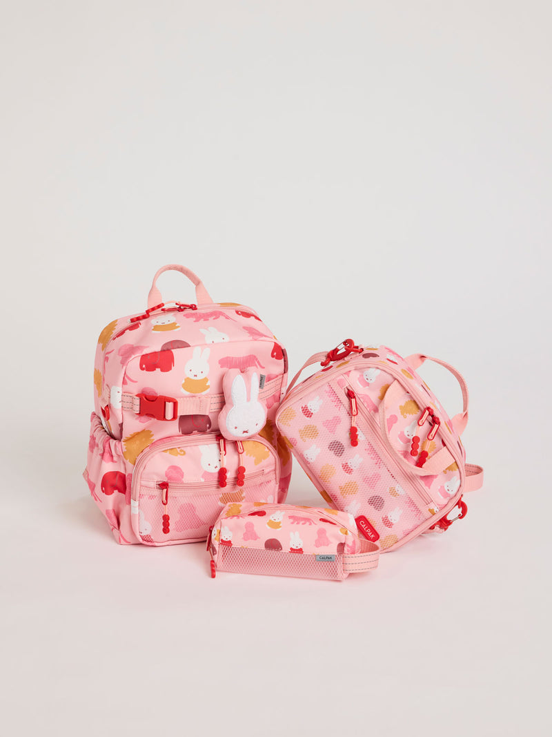 Colorful CALPAK + Miffy Kids Essentials Set with children's Small backpack, lunch bag , pencil case set on a white background with pink accents and Miffy with other animals