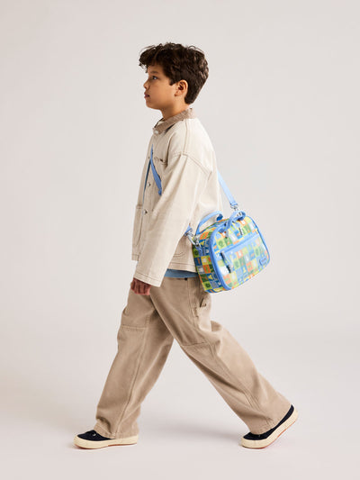 Front side of CALPAK Kids Lunch Bag with Miffy and animal pattern with mesh front pocket and top handles on a white background; CKLB2501-MIFFY-BLUE-ZOO-TRIP view 2