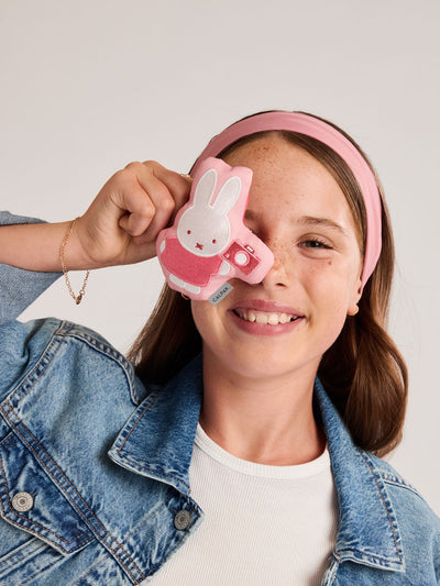 Plush Miffy x CALPAK Pluffy Bag Charm keychain with a pink border and Miffy holding a camera on a white background; APLF2501-MIFFY-MAKES-MEMORIES view 2
