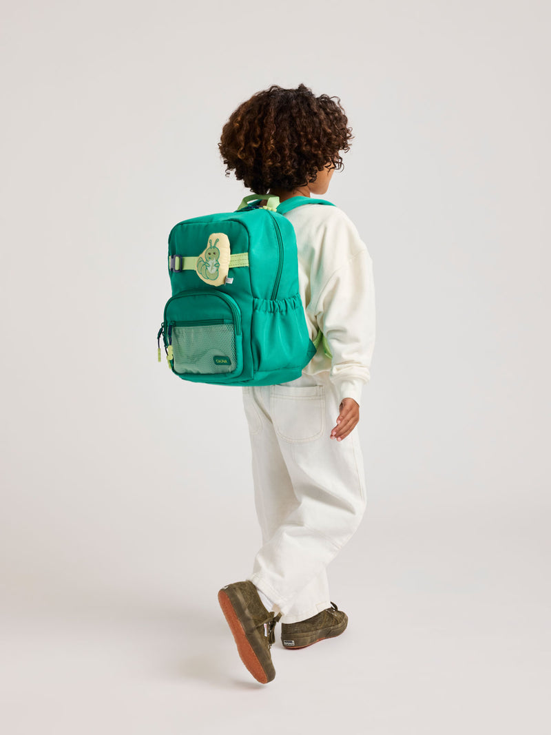 A child wearing the Green CALPAK Kids Small Backpack with lime green accents on a white background