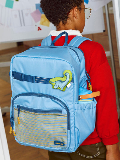 CALPAK Kids Large Backpack in Blue for ages 8-12 is built for your little one’s big days with dark blue zippers and yellow mesh front pocket, multiple interior pockets, and padded comfort straps; CKBL2501-BLUE view 2
