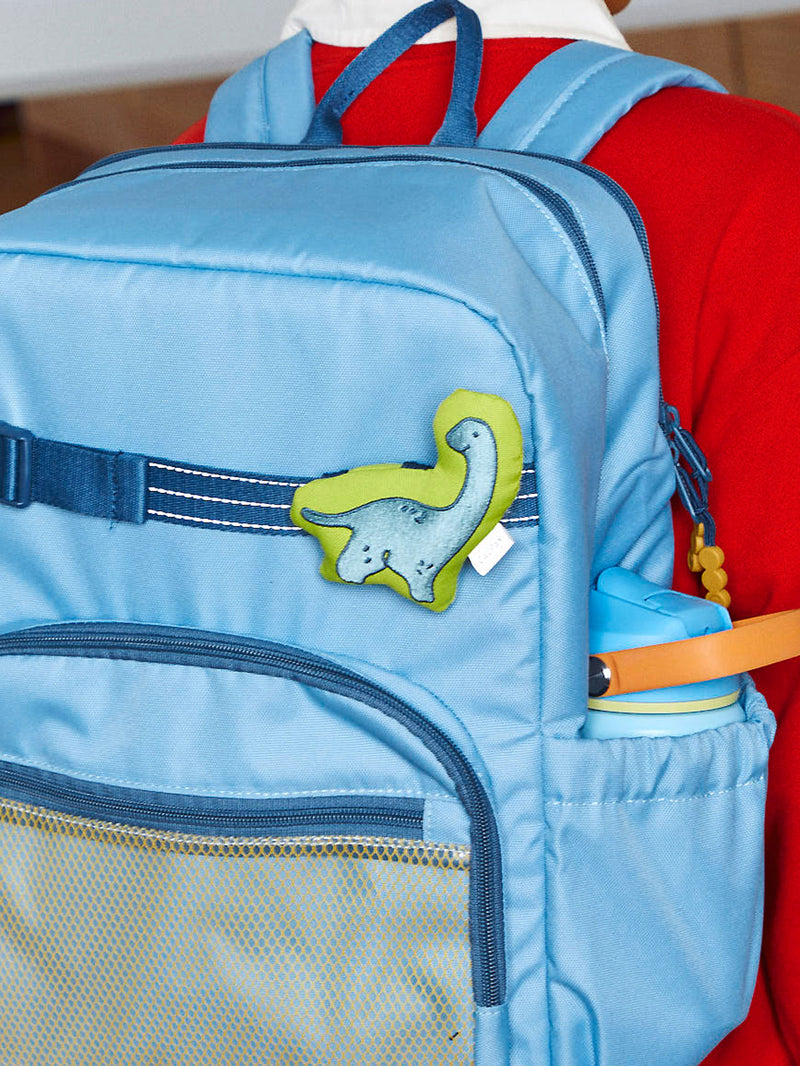 CALPAK Kids Pluffy Bag Charm blue Dinosaur on light green plush attached to Kids Blue Backpack