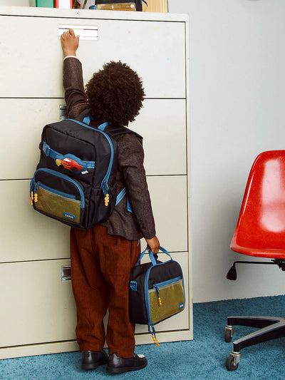 CALPAK Kids Small Backpack in Black for ages 3-5 is built for your little one’s big days with blue zippers and yellow mesh front pocket, multiple interior pockets for an 11” tablet or laptop, and padded comfort straps; CKBS2501-BLACK view 2