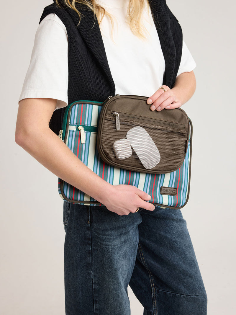 Person holding CALPAK Tech Organizer in brown Mushroom