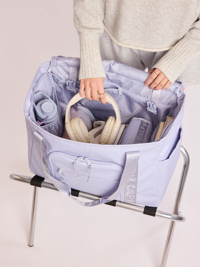 CALPAK Terra 35L Tote Bag with multiple pockets and shoulder straps in shiny light lavender Sea Glass on a white background; TTO2401-SEA-GLASS view 2