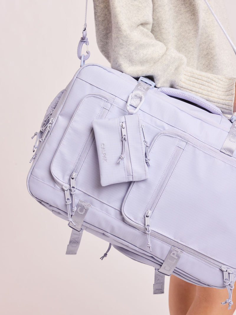 CALPAK Terra Clippable Card Pouch in light purple lavender Sea Glass on a white background with a carabiner clipped on bag