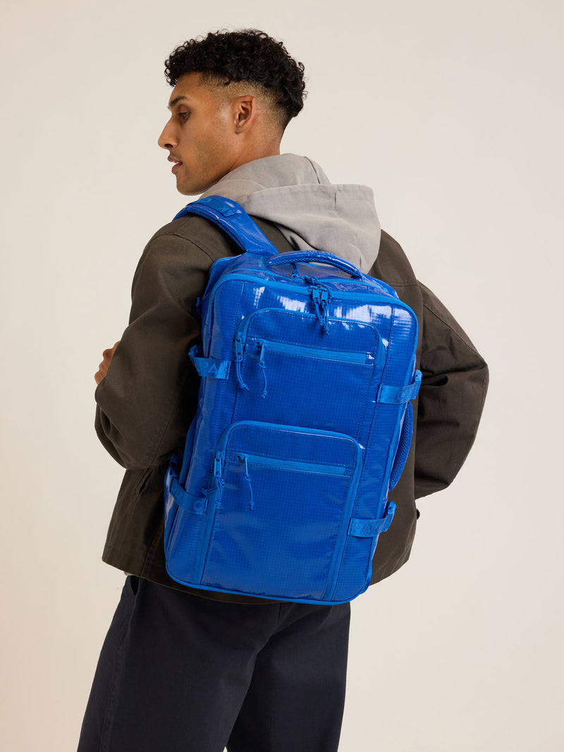 Model with CALPAK Terra 26L Backpack Duffel in blue Cobalt
