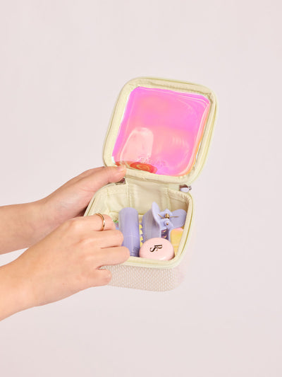 CALPAK Tiny Clear Cometic Case that is square-shaped in iridescent with pink in Moonbeam with a white border on a light gray background; CCT2501-MOONBEAM view 2