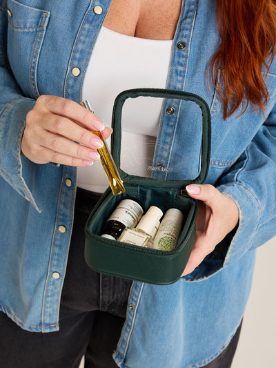 CALPAK Tiny Clear Cosmetics Case in dark green Emerald on a white background; CCT2501-EMERALD view 2